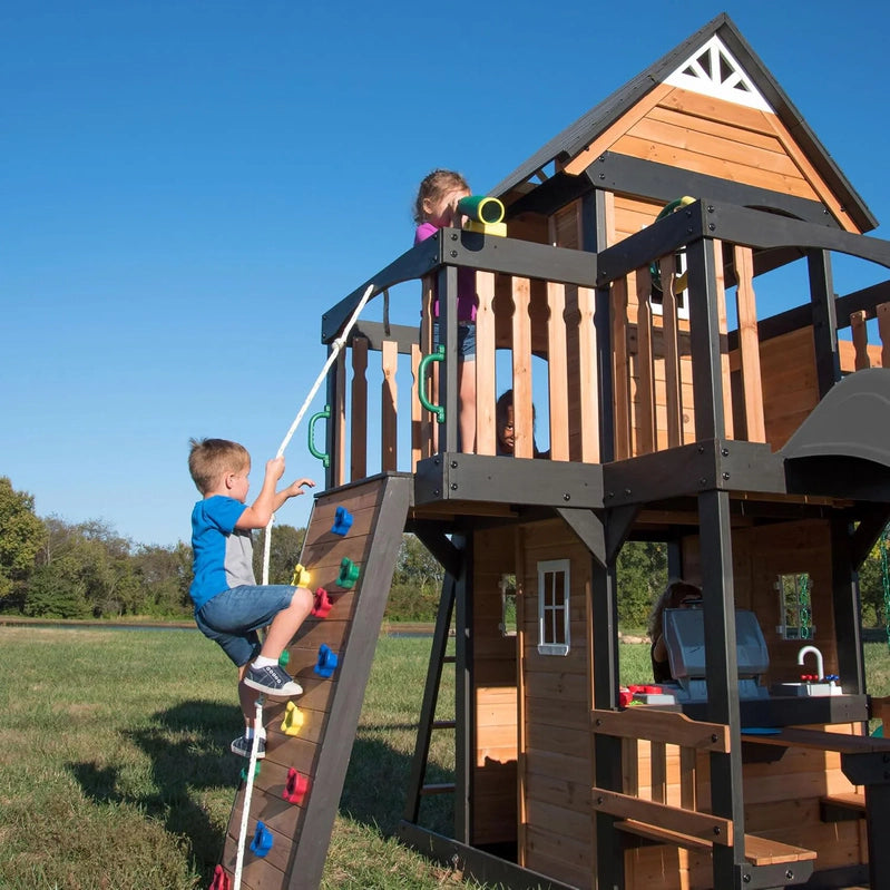 Backyard Discovery Canyon Creek Cedar Wood Swing Set With Wave Slide, Clubhouse, Play Kitchen, Picnic Area, Belt Swings, Web Swing, Rock Wall